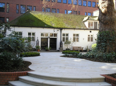 Photograph showing a garden path leading up to the seventeenth-century warehouse where the new archive store and reading room are located.